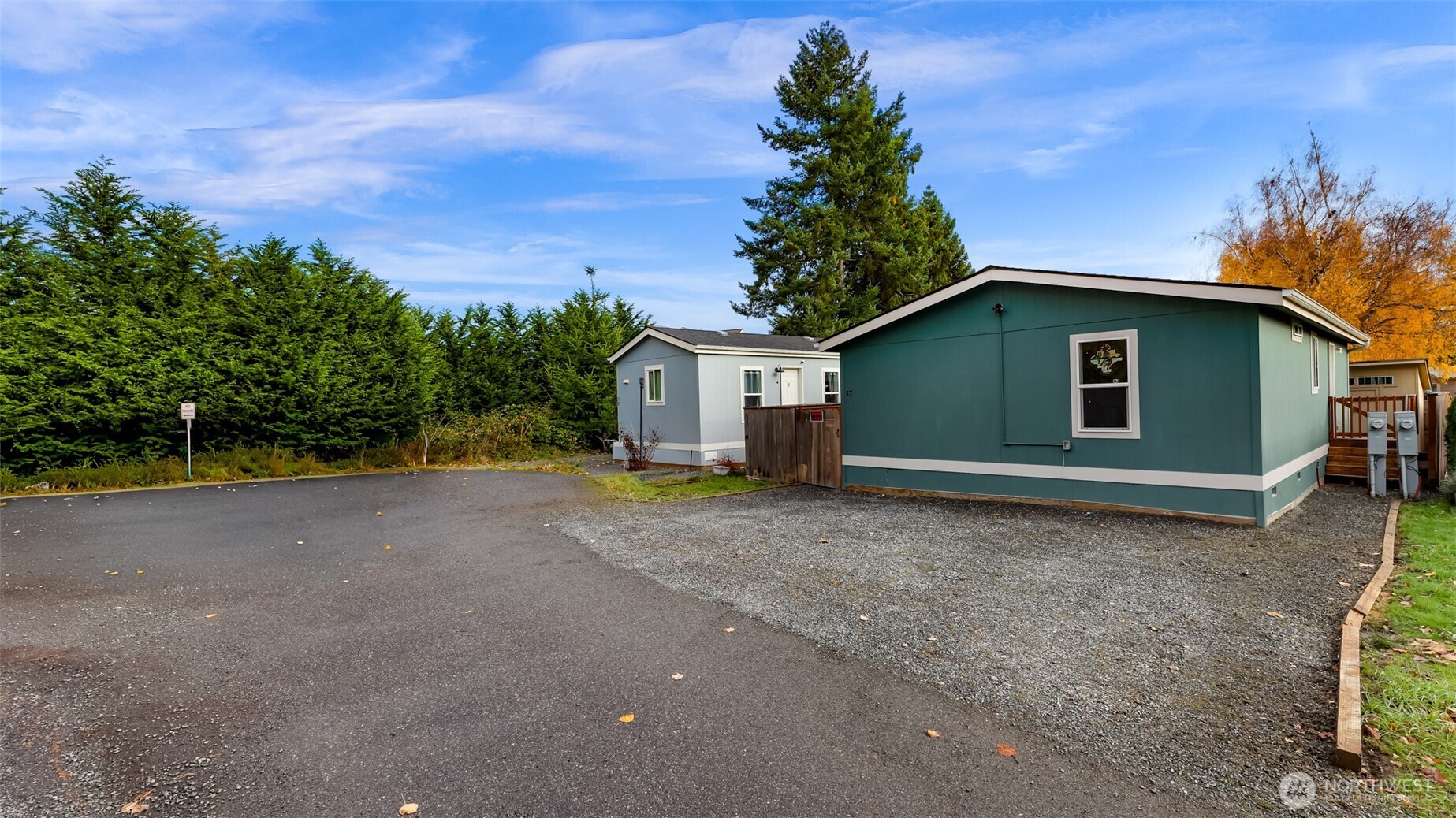 2392 Douglas Road, Unit 57 Ferndale, WA 98248 - Photo 25 of 26 a view of a house with a yard and garage