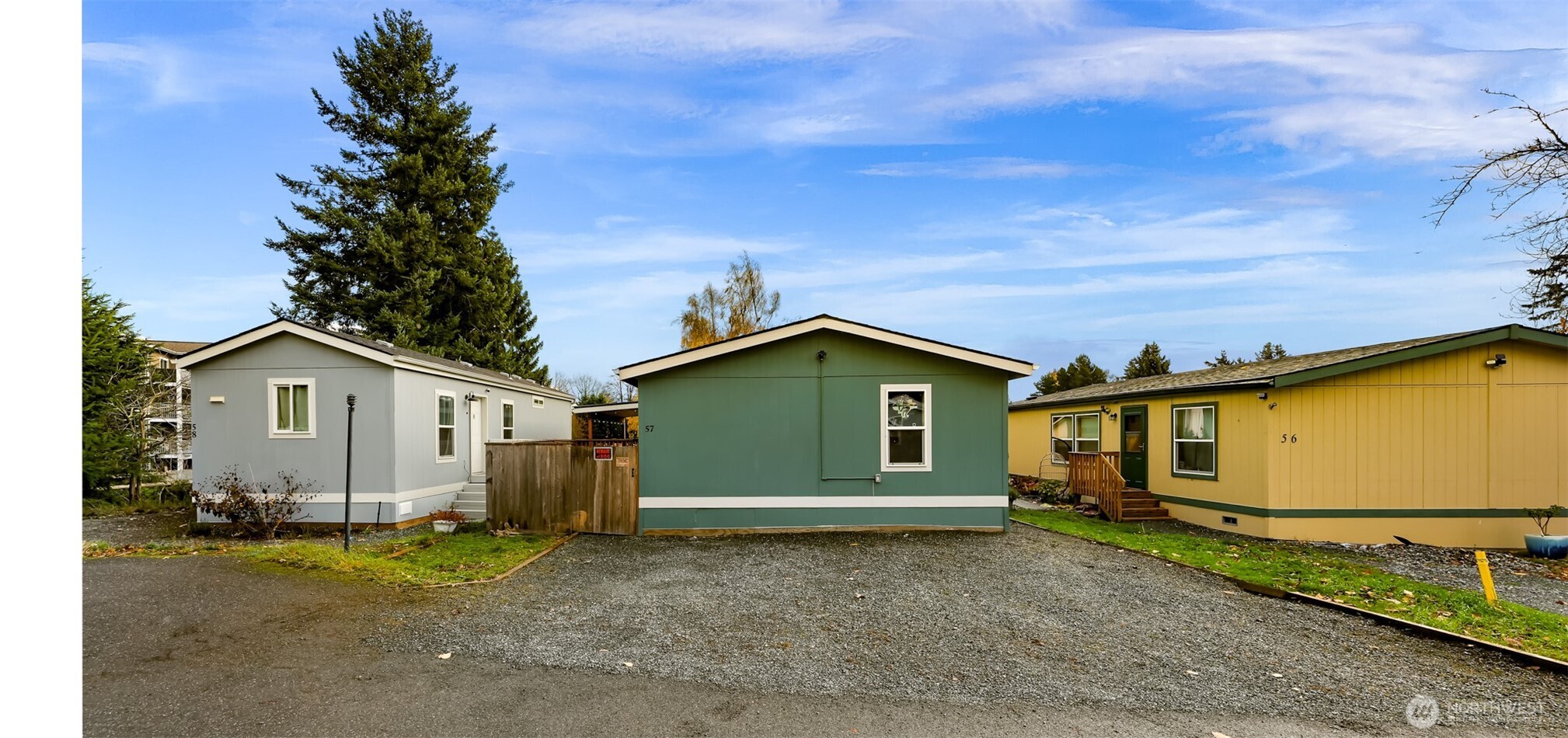 2392 Douglas Road, Unit 57 Ferndale, WA 98248 - Photo 5 of 26 a view of a house with a backyard