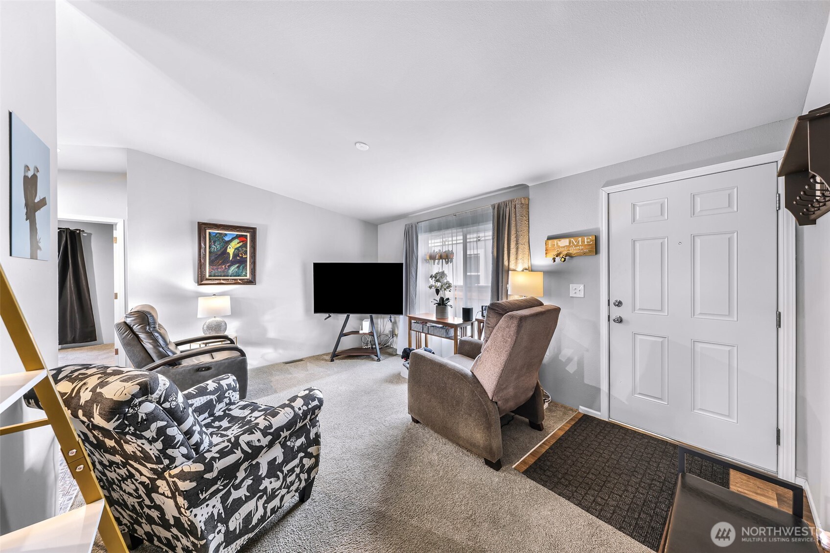 2392 Douglas Road, Unit 57 Ferndale, WA 98248 - Photo 7 of 26 a living room with furniture a flat screen tv and a window