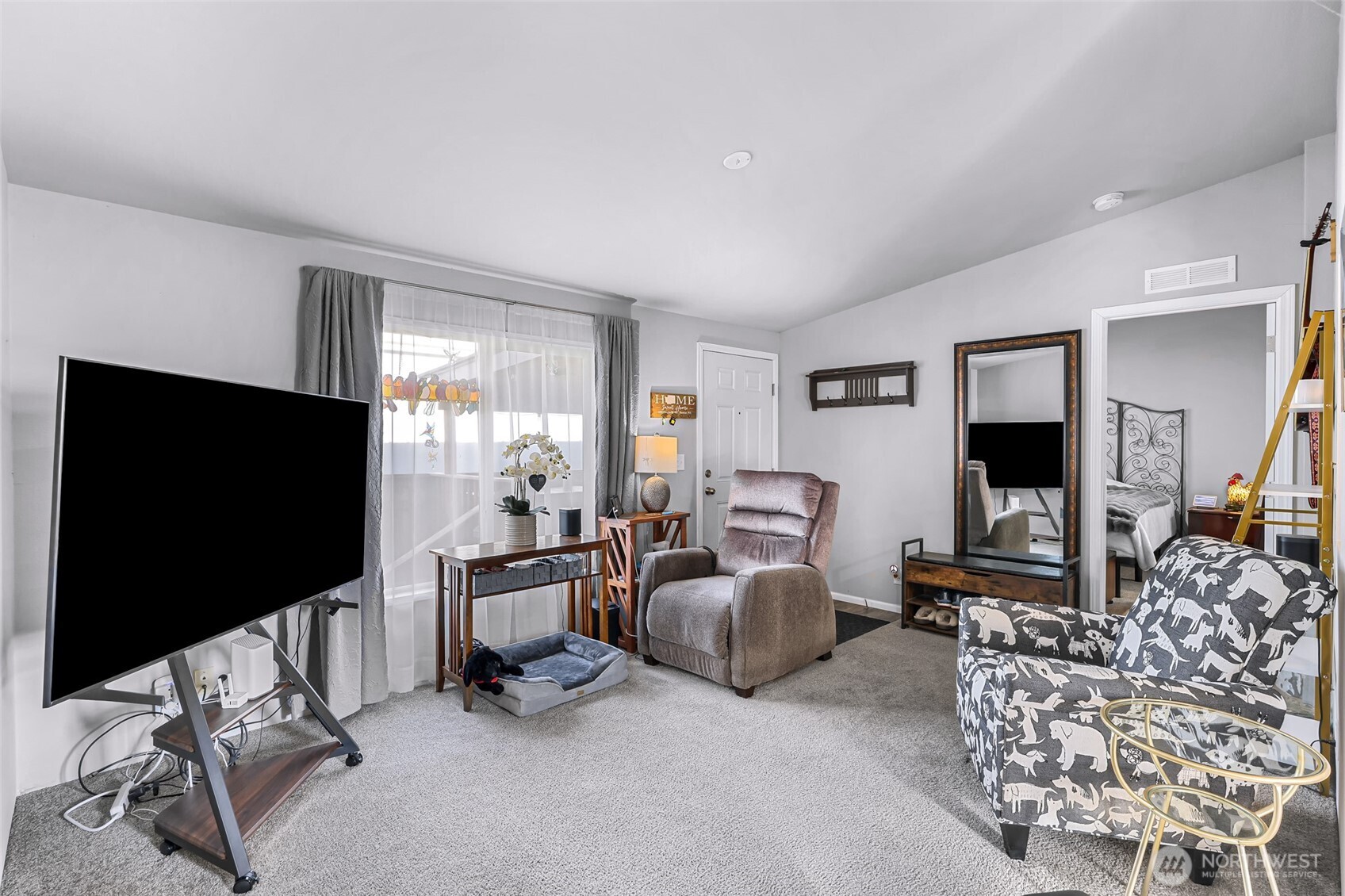 2392 Douglas Road, Unit 57 Ferndale, WA 98248 - Photo 8 of 26 a living room with furniture and a flat screen tv