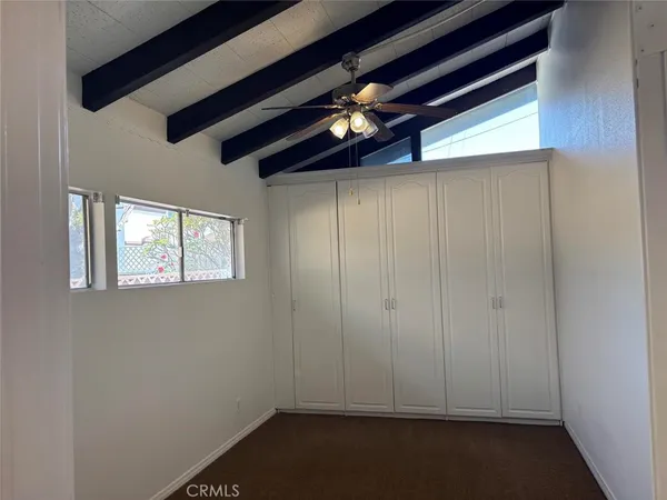 a white toilet sitting next to a bath tub