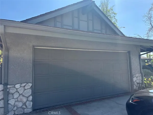a kitchen with granite countertop cabinets stainless steel appliances and a sink