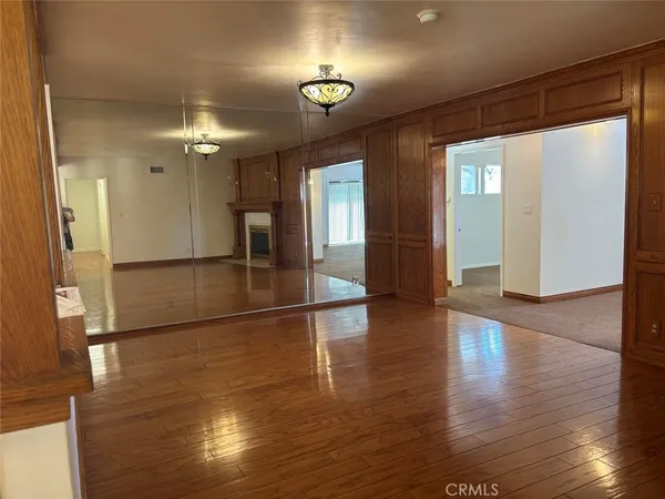 a kitchen with granite countertop cabinets stainless steel appliances and a counter space