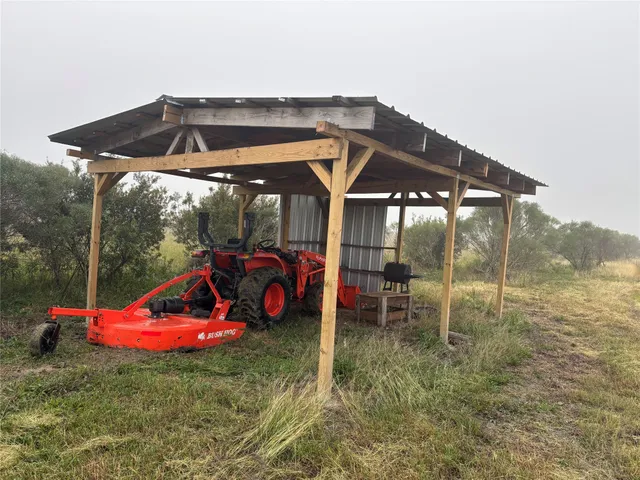 a view of a chair and table in the patio
