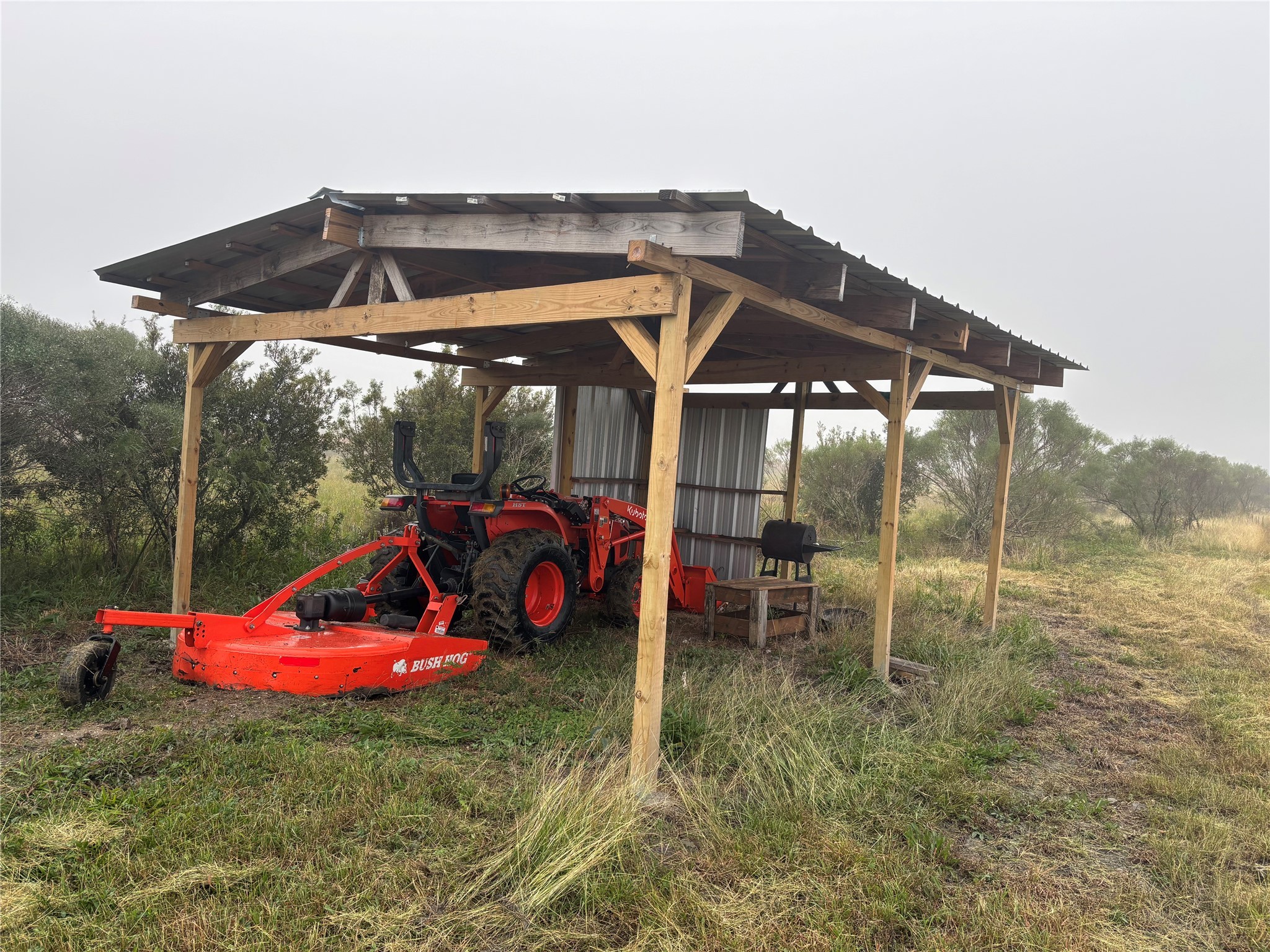 a view of a chair and table in the patio