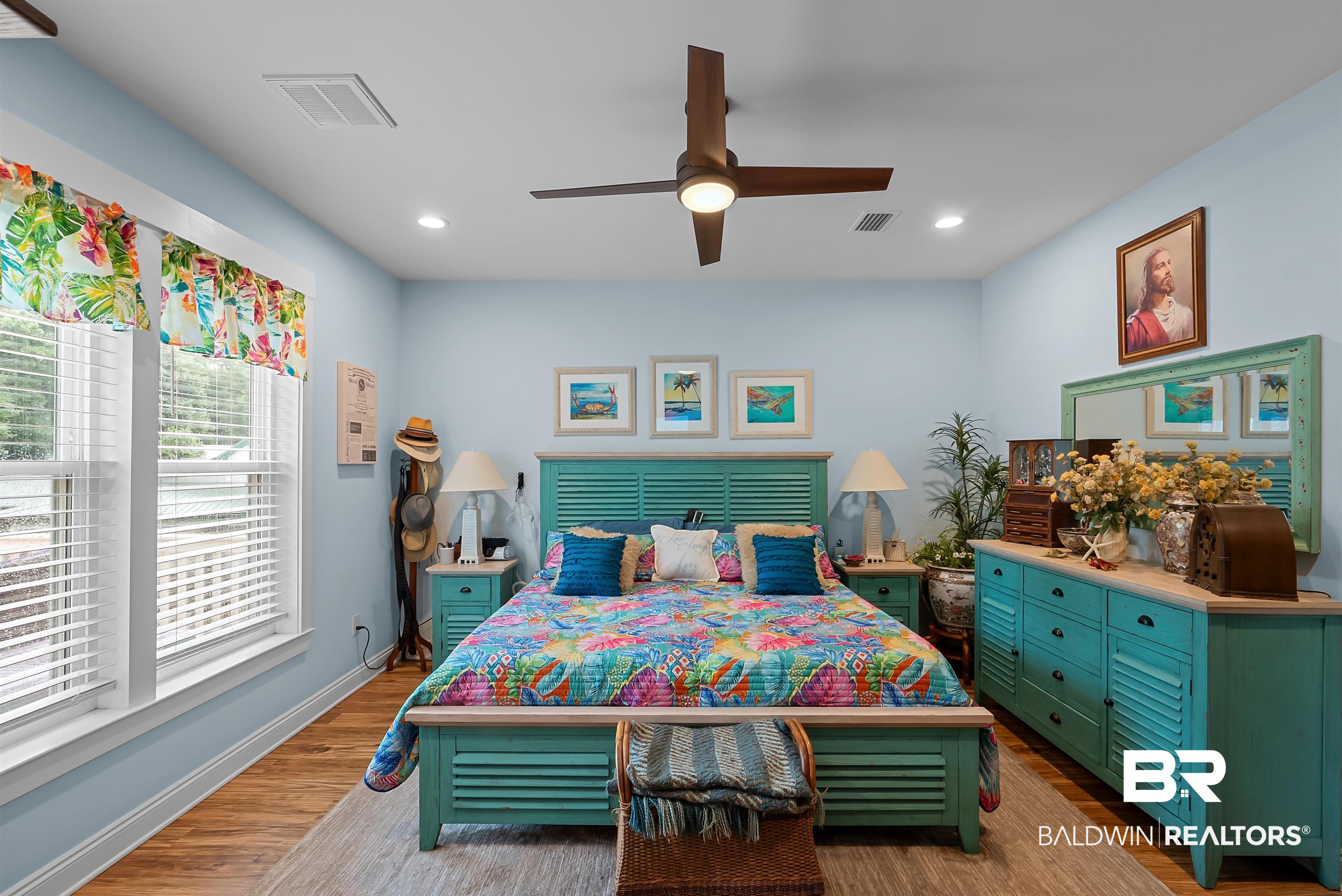 7266 Franklin Road Foley, AL 36535 - Photo 25 of 64 Spacious room featuring wood-finish flooring, two window units with blinds, recessed lighting, and a ceiling fan