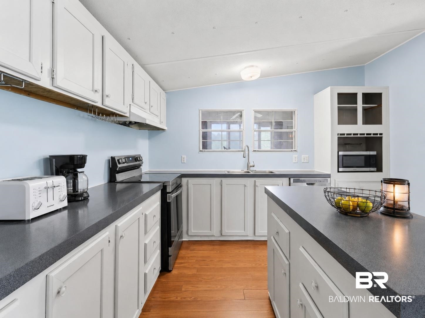 26788 Feely Road Elberta, AL 36530 - Photo 2 of 31 Kitchen featuring white cabinetry, dark countertops, a stainless steel range, and wood-finish flooring