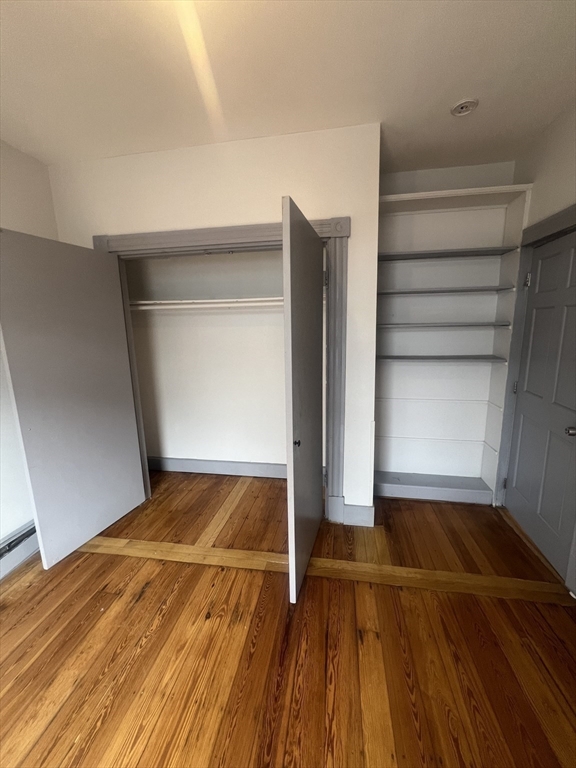 4 Herbert Street, Unit 2 Boston, MA 02124 - Photo 4 of 12 a view of wooden floor in a room