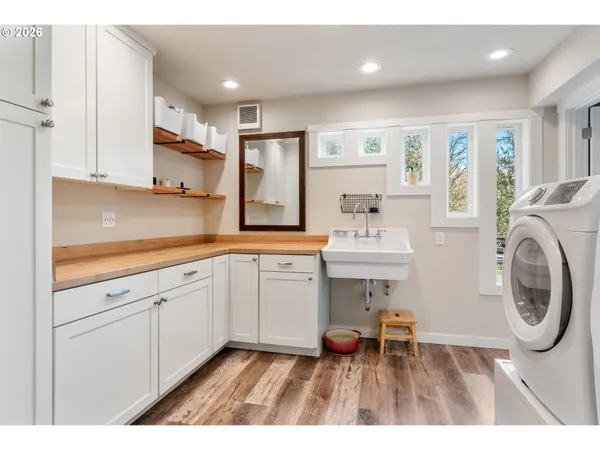 a bathroom with a sink a mirror and a toilet