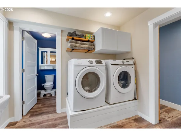 a view of a kitchen with washer and dryer