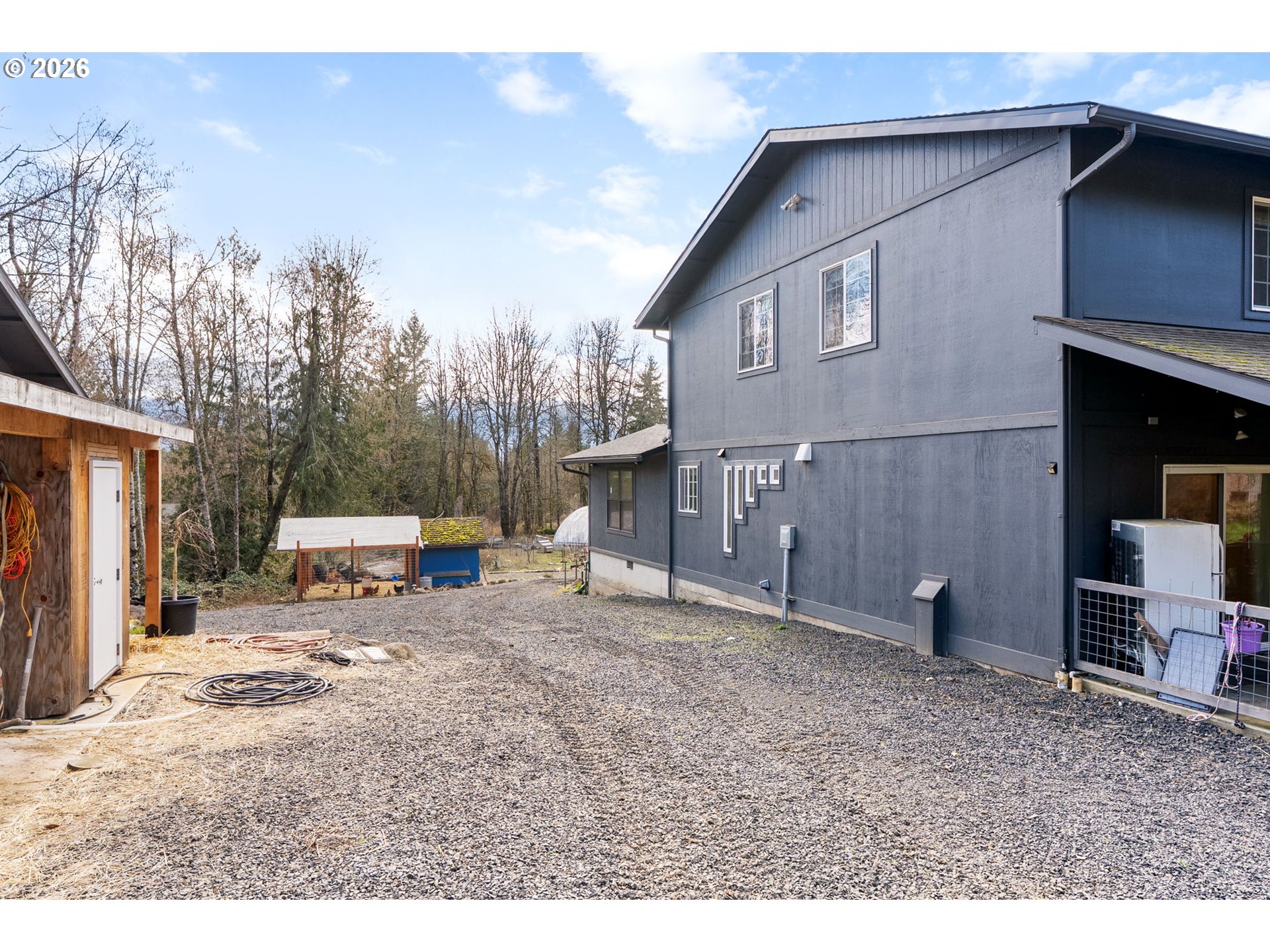 92 Rancho Del Oro Road Stevenson, WA 98648 - Photo 37 of 45 a view of a house with a patio and a yard