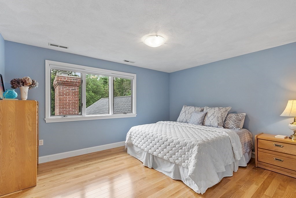7 Powers Road Andover, MA 01810 - Photo 27 of 42 a bedroom with a bed and a window