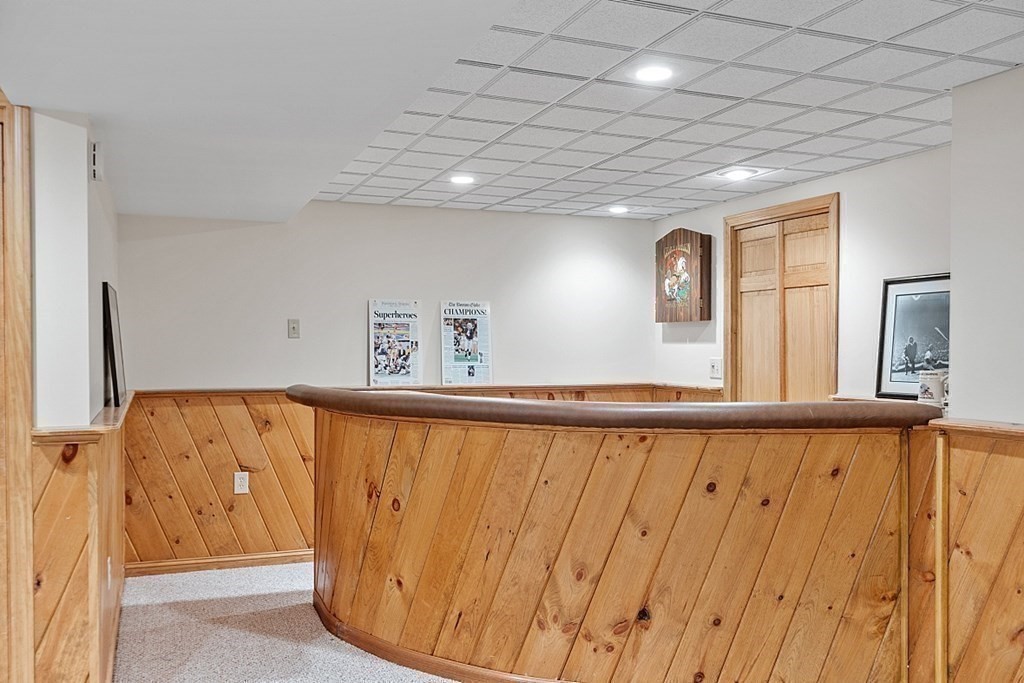 7 Powers Road Andover, MA 01810 - Photo 34 of 42 a view of a car garage with wooden floor
