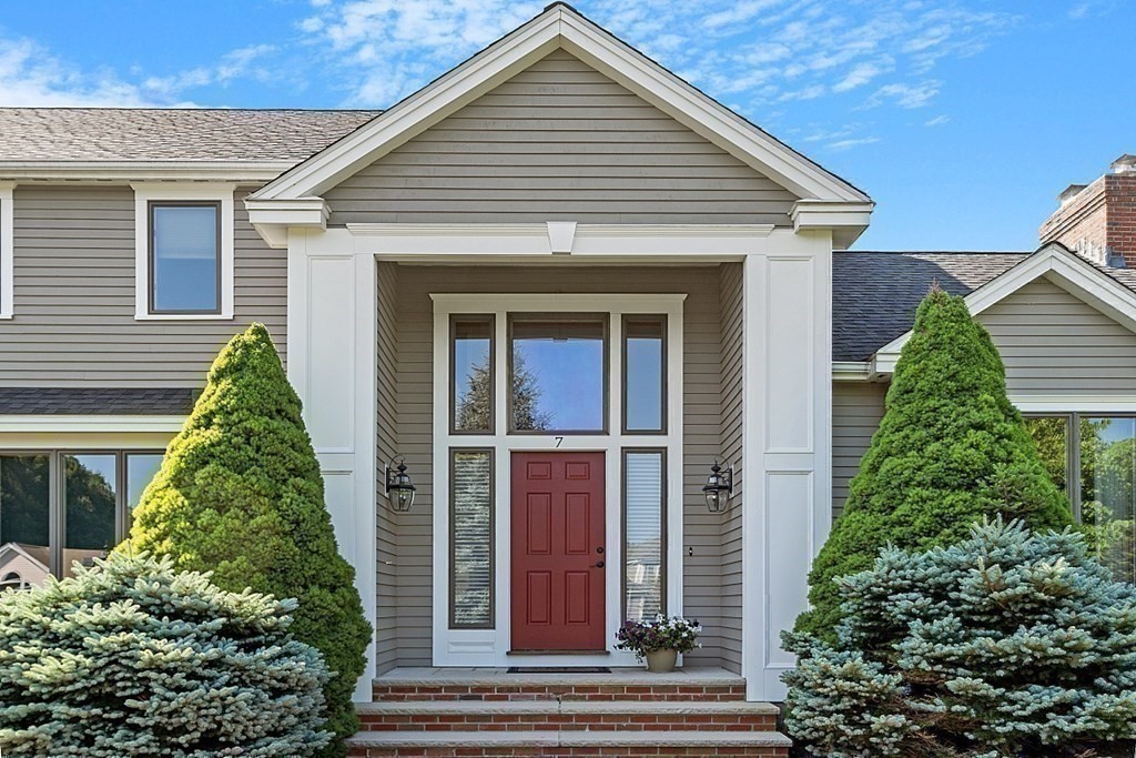 7 Powers Road Andover, MA 01810 - Photo 7 of 42 a front view of a house with a yard