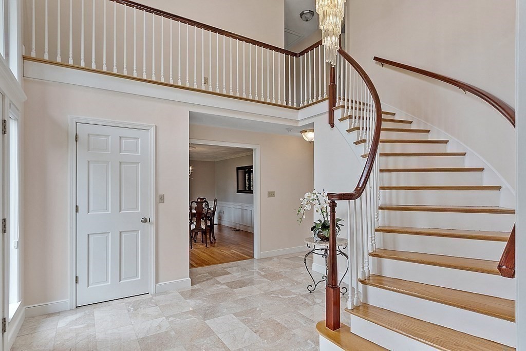 7 Powers Road Andover, MA 01810 - Photo 8 of 42 a view of staircase with white walls and railing