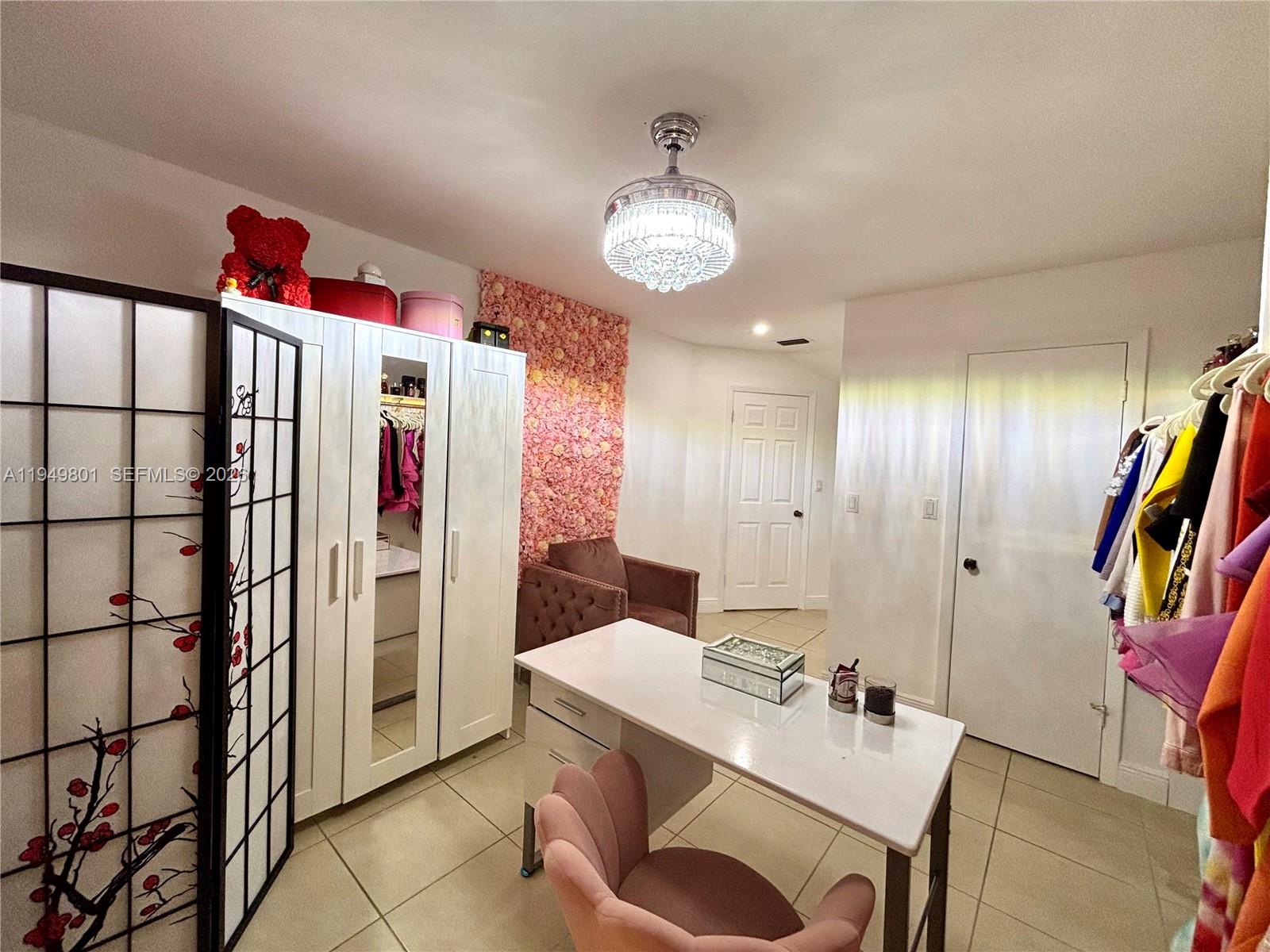 8384 Southwest 154th Avenue, Unit 68 Miami, FL 33193 - Photo 16 of 47 a bathroom with a sink and a mirror