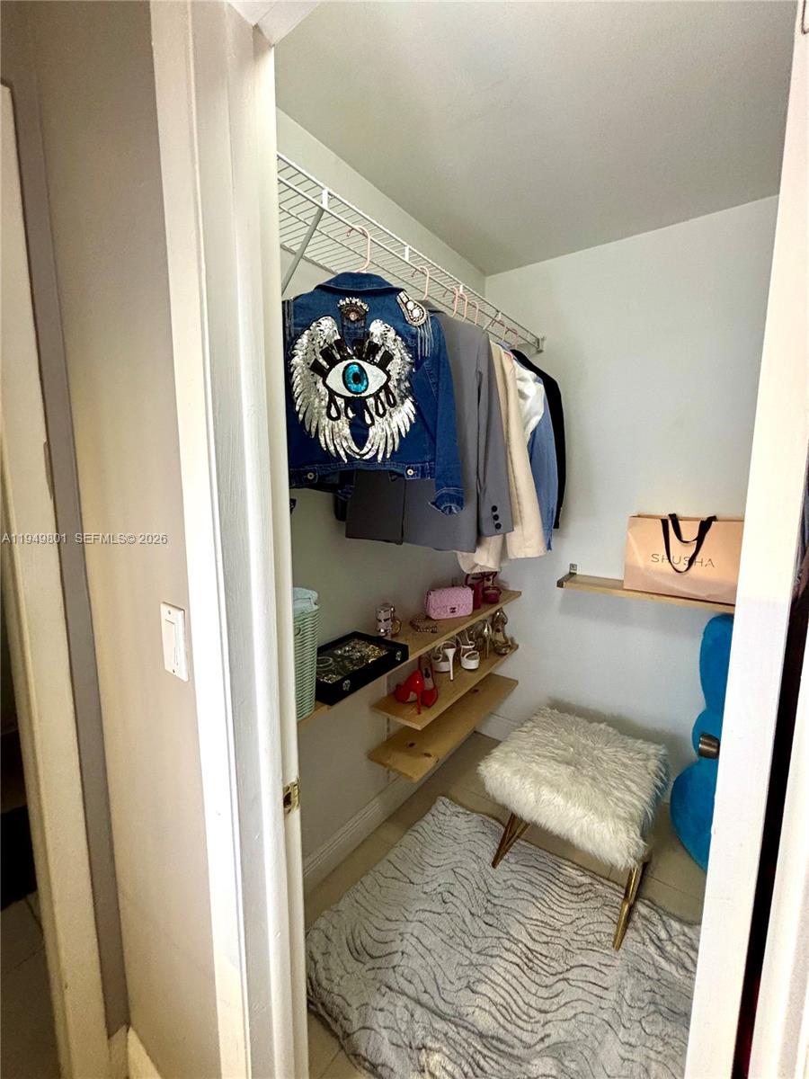 8384 Southwest 154th Avenue, Unit 68 Miami, FL 33193 - Photo 17 of 47 a view of living room with furniture and rug