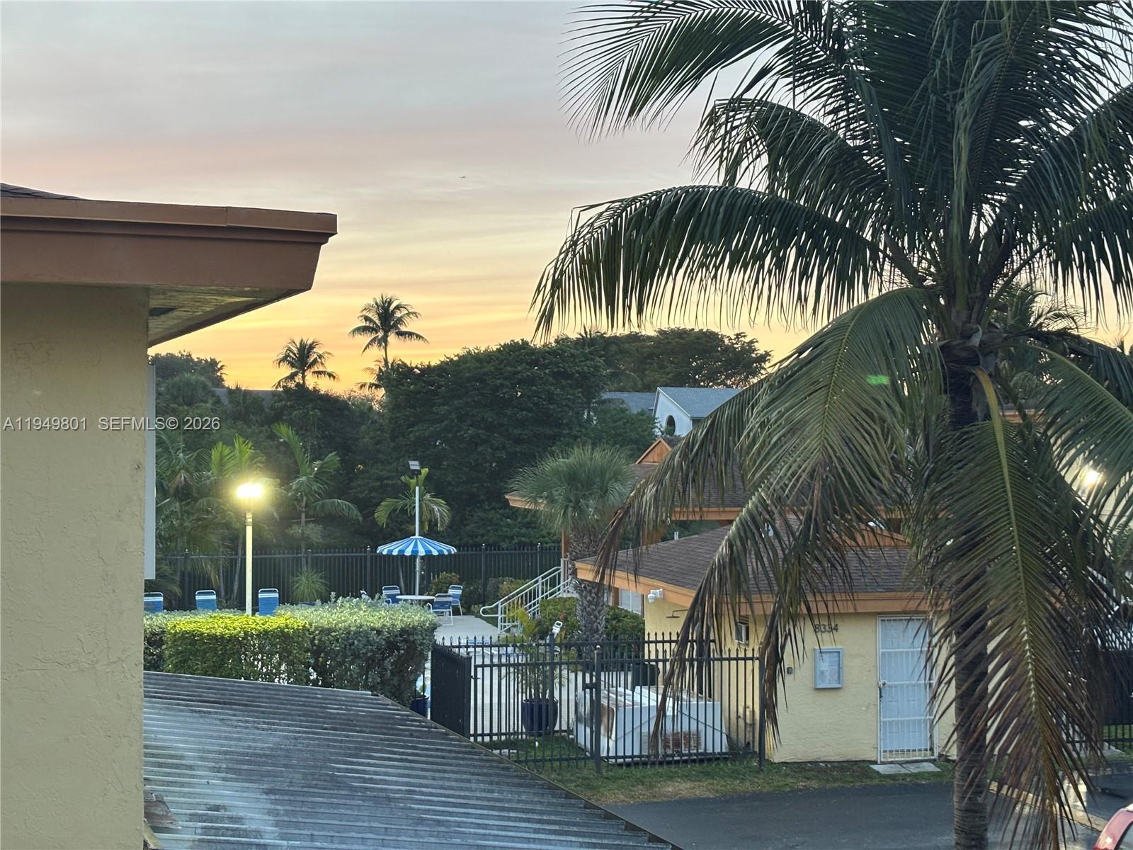 8384 Southwest 154th Avenue, Unit 68 Miami, FL 33193 - Photo 22 of 47 a view of a palm trees in front of a house