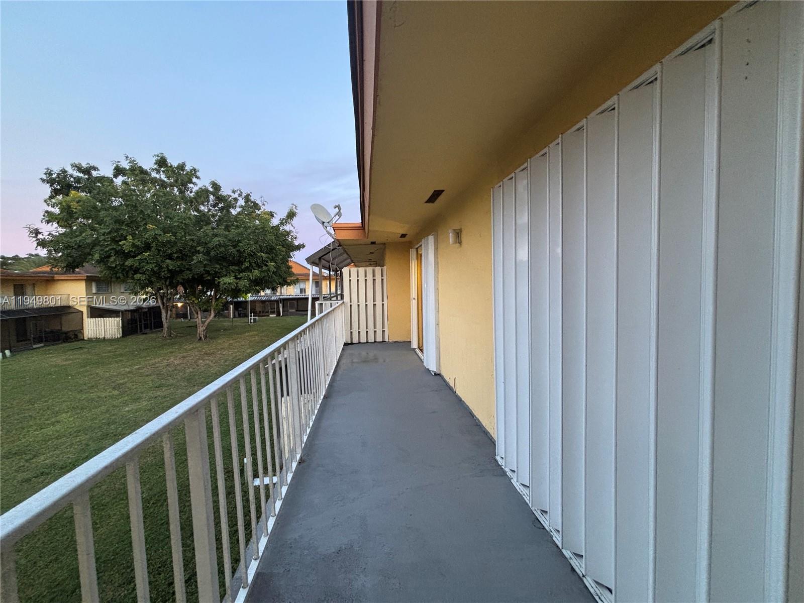8384 Southwest 154th Avenue, Unit 68 Miami, FL 33193 - Photo 25 of 47 a view of a balcony with an outdoor space