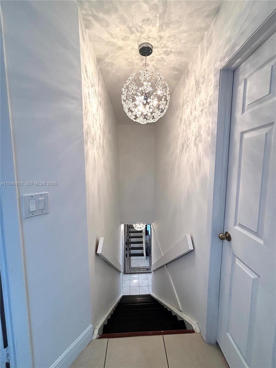 8384 Southwest 154th Avenue, Unit 68 Miami, FL 33193 - Photo 38 of 47 a view of a hallway with a small space