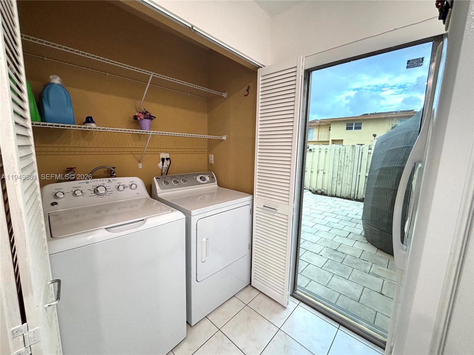 8384 Southwest 154th Avenue, Unit 68 Miami, FL 33193 - Photo 41 of 47 a utility room with dryer and washer