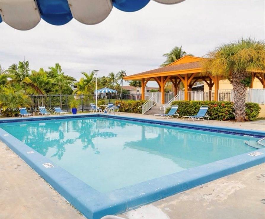 8384 Southwest 154th Avenue, Unit 68 Miami, FL 33193 - Photo 47 of 47 a view of swimming pool with a yard