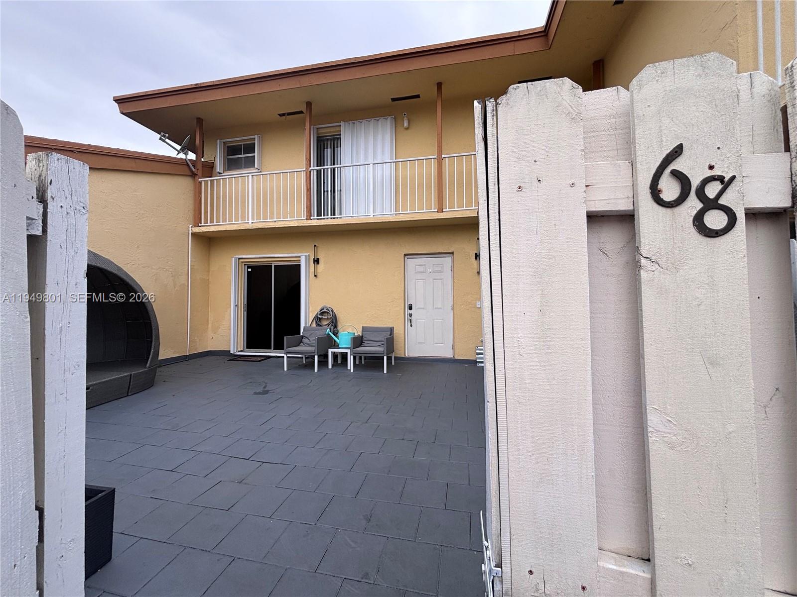 8384 Southwest 154th Avenue, Unit 68 Miami, FL 33193 - Photo 5 of 47 a view of living room with furniture and a fireplace