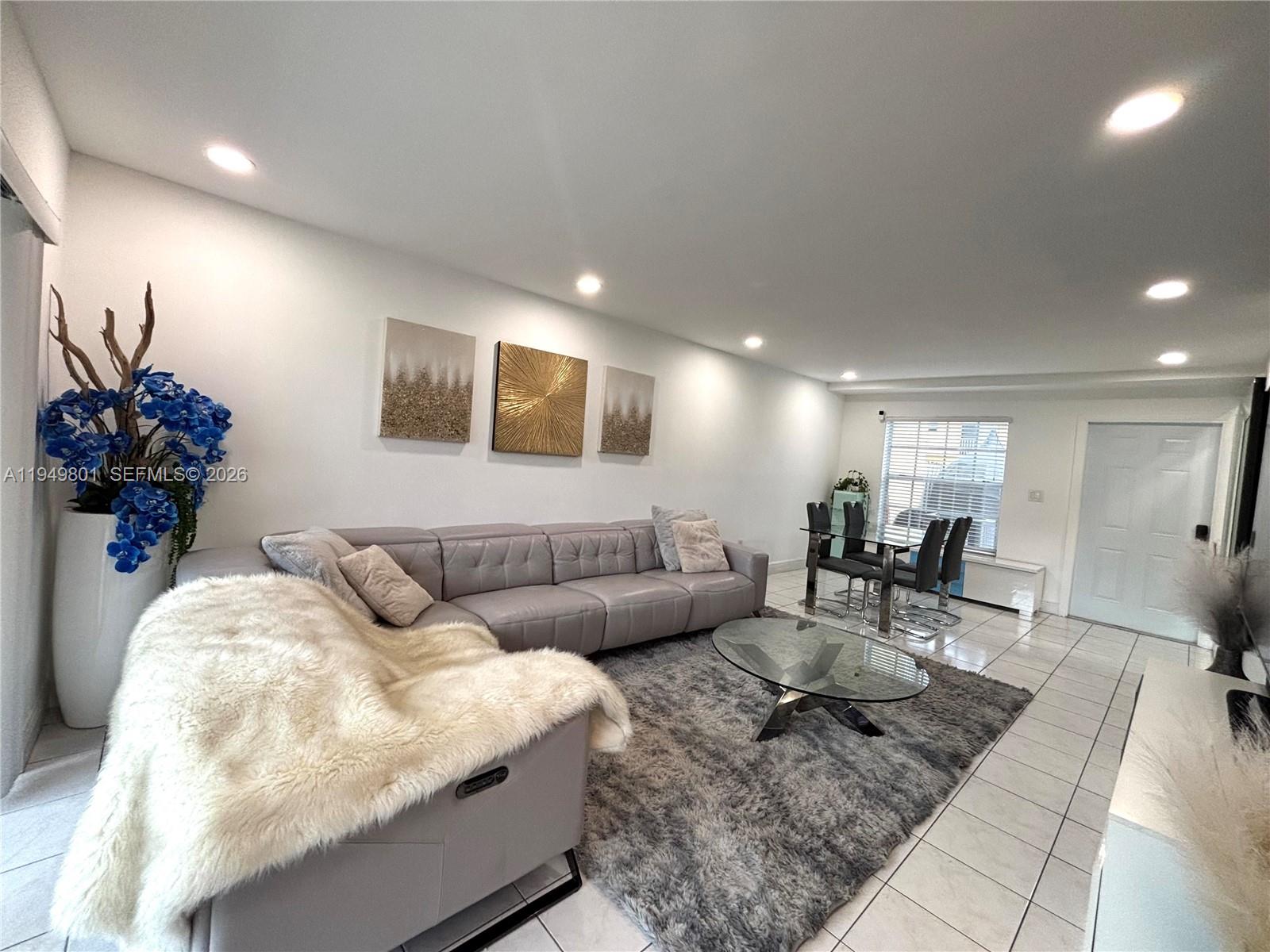 8384 Southwest 154th Avenue, Unit 68 Miami, FL 33193 - Photo 8 of 47 a living room with furniture and a couch