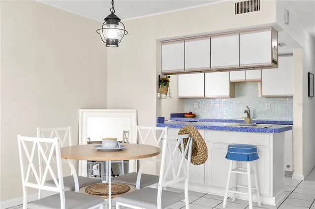 a kitchen with stainless steel appliances granite countertop a sink and a stove