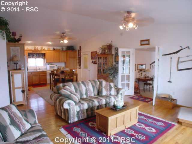 4835 Meridian Road Peyton, CO 80831 - Photo 5 of 16 Living Room and Kitchen