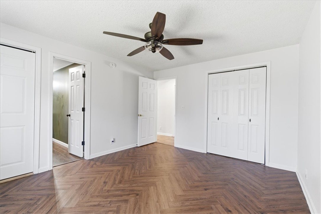 112 Newry Road Seneca, SC 29672 - Photo 11 of 19 This spacious bedroom features warm wood flooring and ample closet space, perfect for comfortable living.