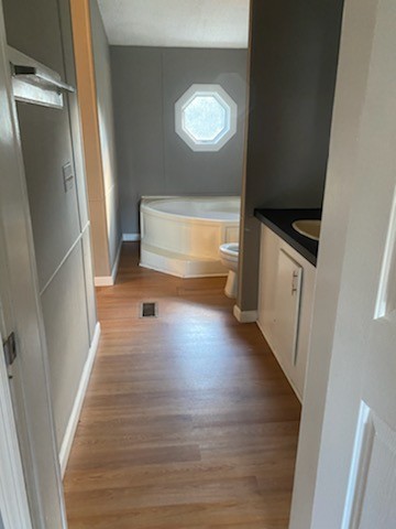 5683 Lakeview Road Springfield, TN 37172 - Photo 2 of 10 a view of a hallway to an empty room with wooden floor and a window