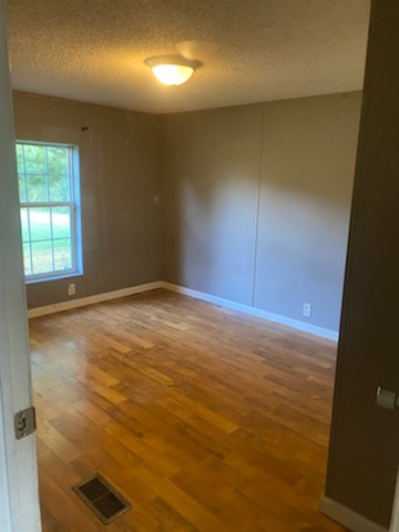 5683 Lakeview Road Springfield, TN 37172 - Photo 8 of 10 wooden floor in an empty room with a window