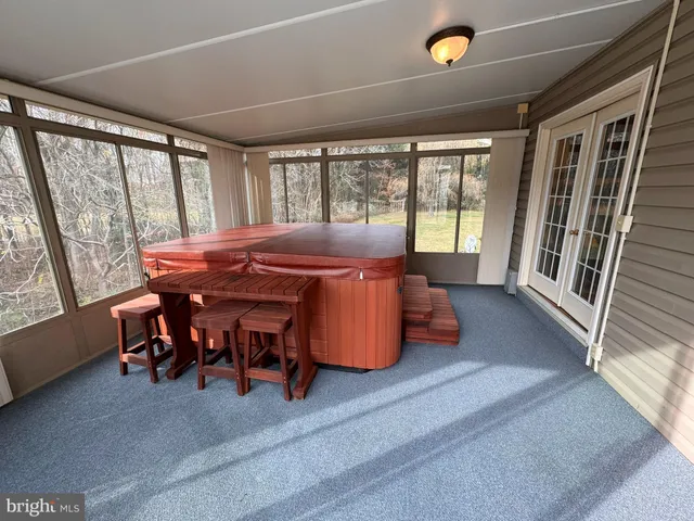 a dining room with furniture and windows