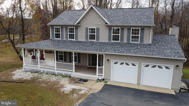 a front view of a house with a large window
