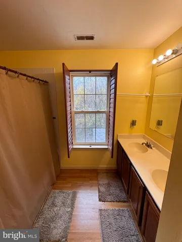 a bathroom with a toilet and shower