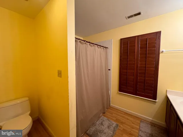 a bathroom with a tub a sink and a shower