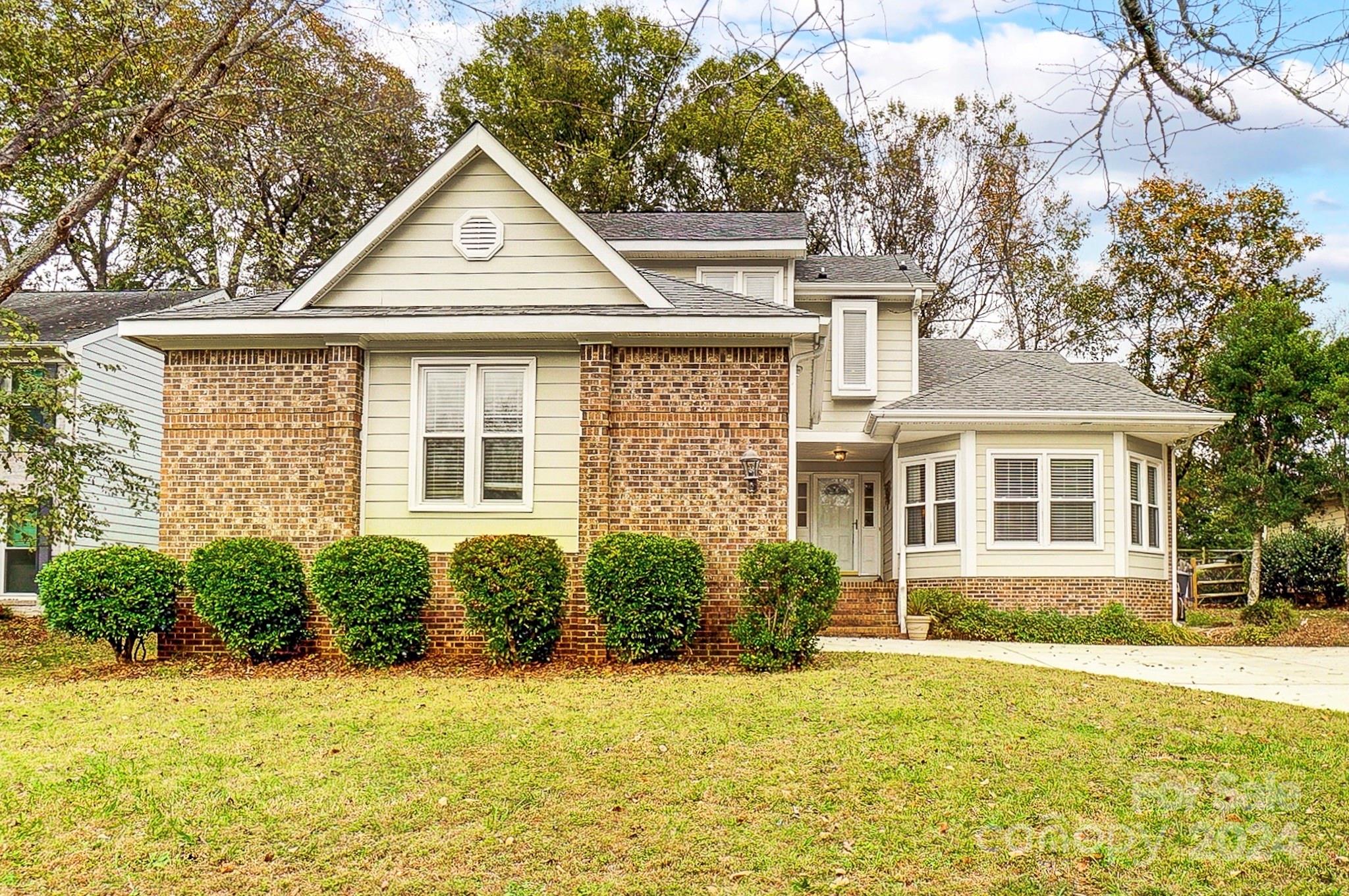 10454 Fairway Ridge Road Charlotte, NC 28277 - Photo 1 of 41 a front view of a house with a yard and garage