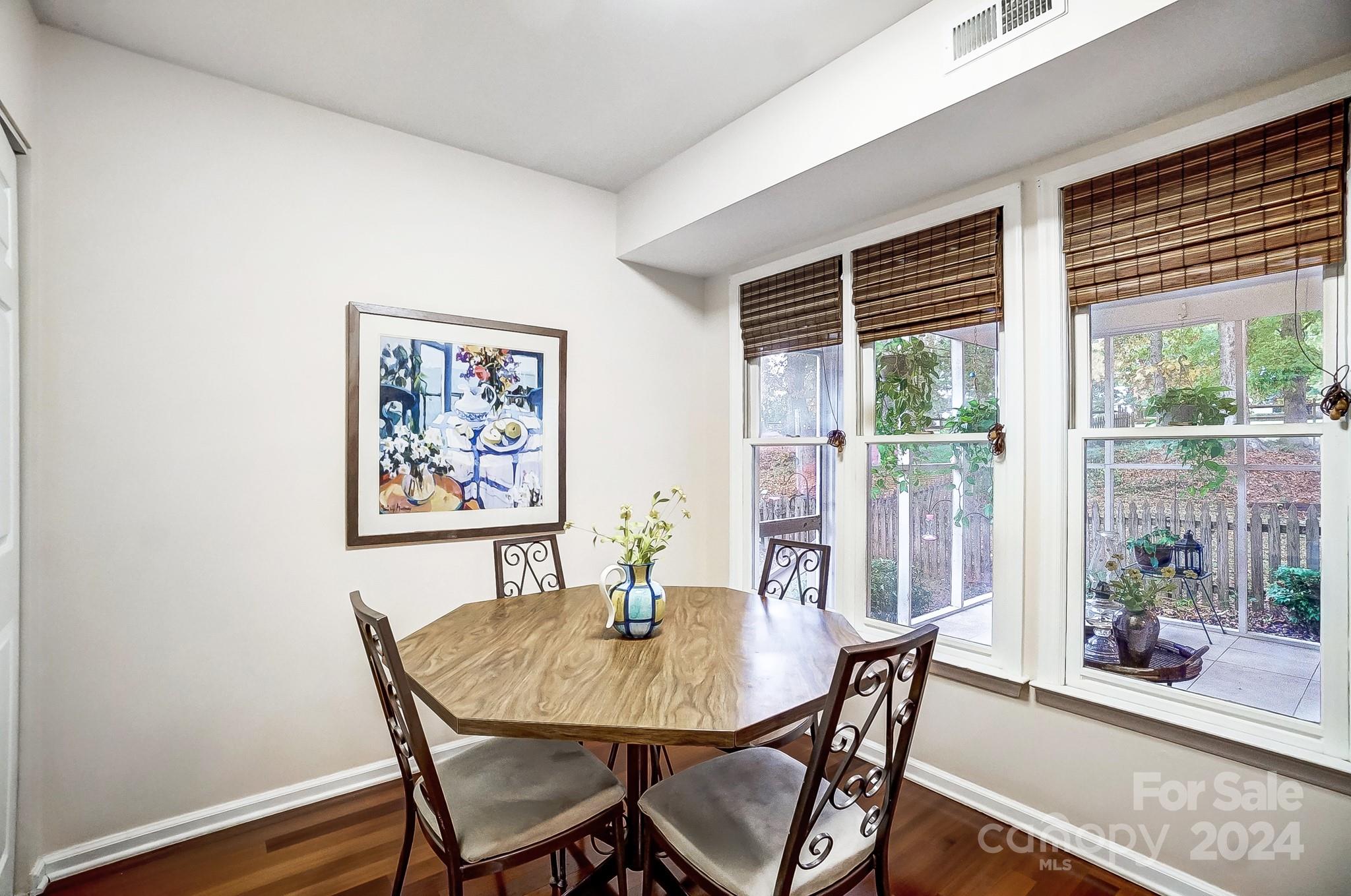 10454 Fairway Ridge Road Charlotte, NC 28277 - Photo 16 of 41 a view of a dining room with furniture window and wooden floor