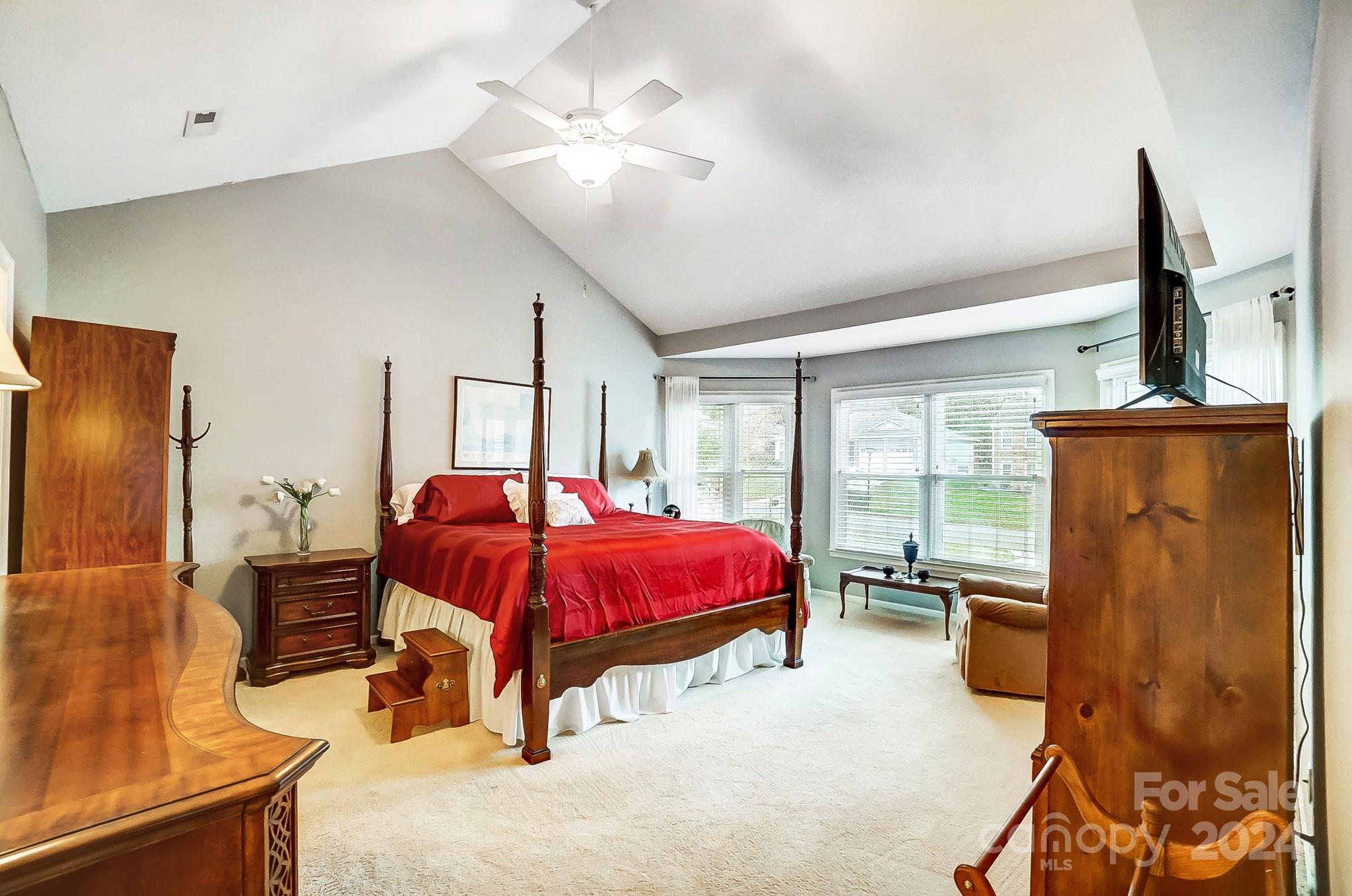 10454 Fairway Ridge Road Charlotte, NC 28277 - Photo 19 of 41 a bedroom with a bed dresser and a window
