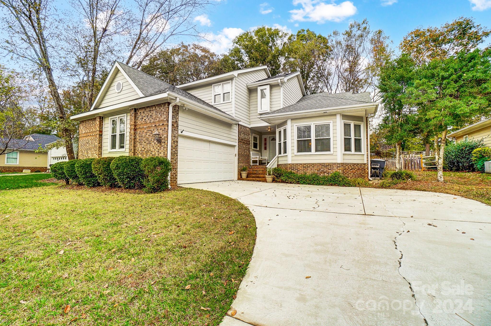 10454 Fairway Ridge Road Charlotte, NC 28277 - Photo 3 of 41 a front view of a house with a yard
