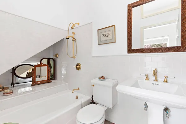 a bathroom with a sink a toilet and a bathtub
