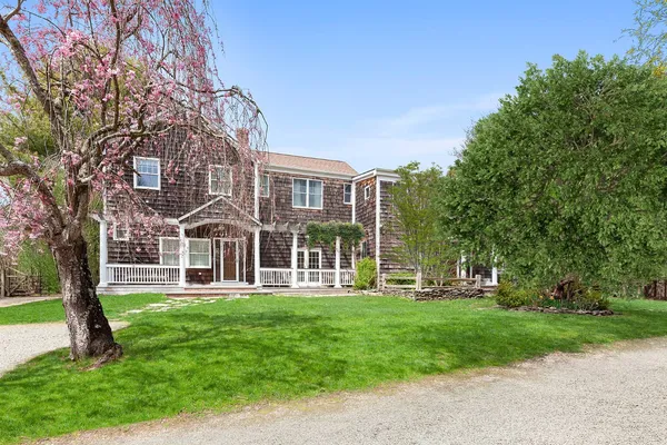 front view of a house with a yard