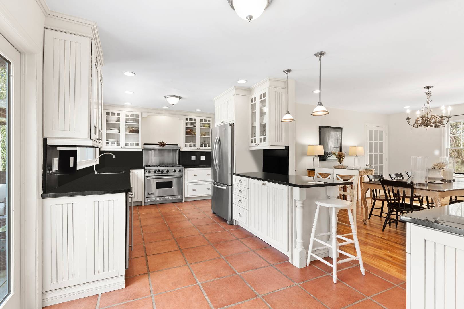 Undisclosed Address Bridgehampton, NY 11932 - Photo 7 of 17 a kitchen with stainless steel appliances kitchen island granite countertop a refrigerator and cabinets