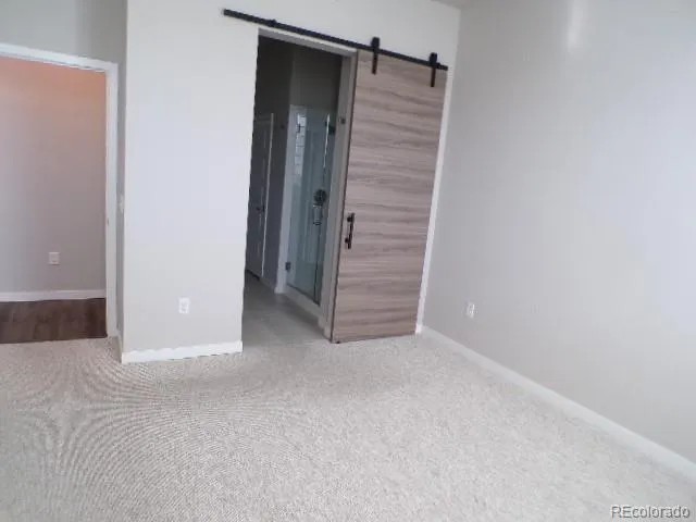 a view of an empty room with stairs