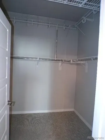 a view of an empty walk in closet
