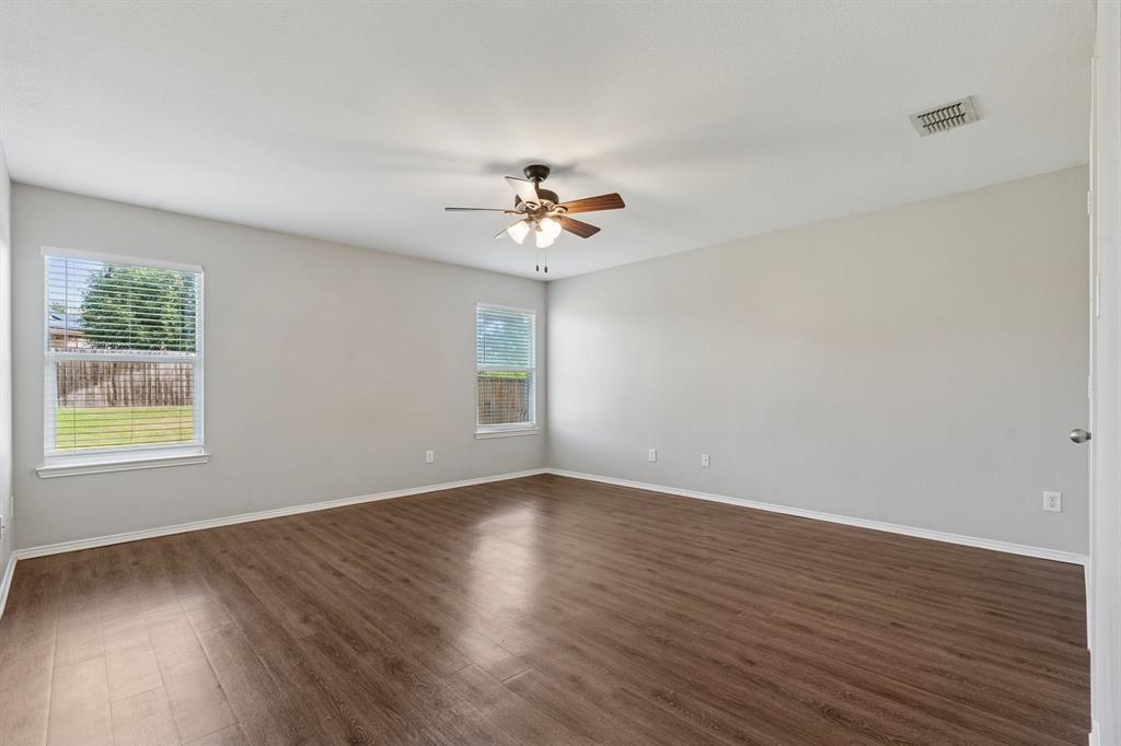 3005 Groveland Terrace Denton, TX 76210 - Photo 15 of 26 wooden floor in an empty room with a window