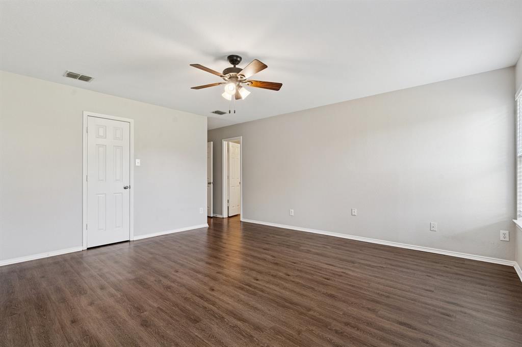 3005 Groveland Terrace Denton, TX 76210 - Photo 16 of 26 a view of an empty room with wooden floor