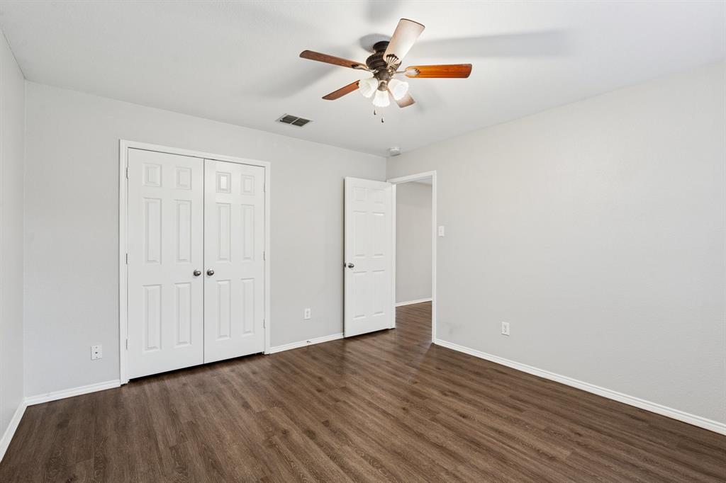 3005 Groveland Terrace Denton, TX 76210 - Photo 18 of 26 a view of an empty room with wooden floor