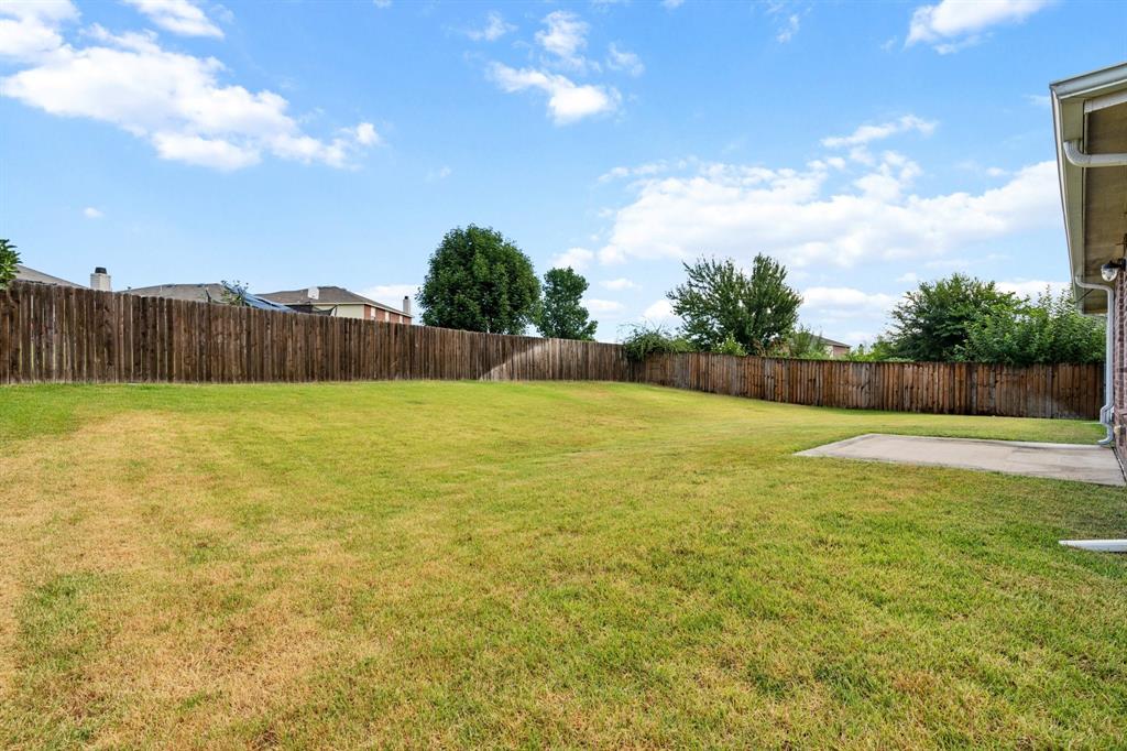 3005 Groveland Terrace Denton, TX 76210 - Photo 22 of 26 a view of a swimming pool and a yard
